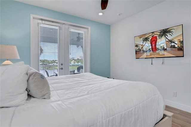 bedroom with ceiling fan, access to exterior, and hardwood / wood-style flooring