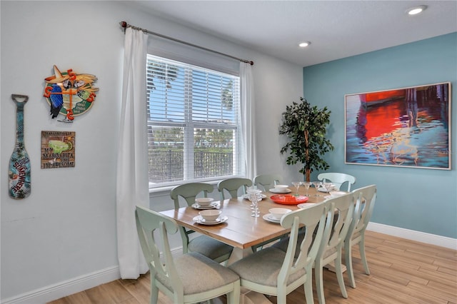 dining room with light hardwood / wood-style flooring