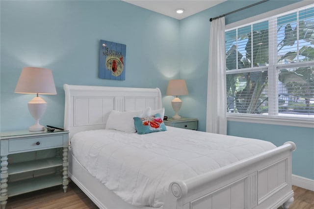 bedroom with hardwood / wood-style floors