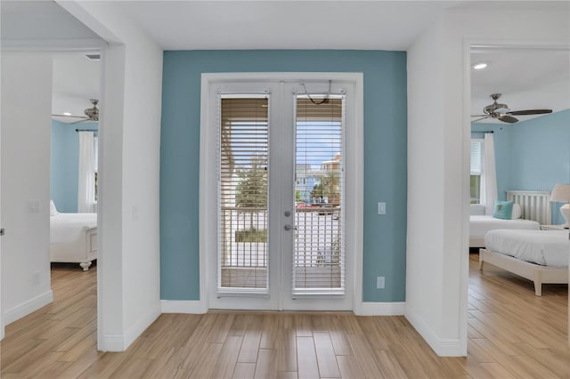 doorway with ceiling fan and french doors