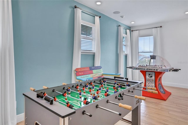 recreation room featuring light hardwood / wood-style flooring