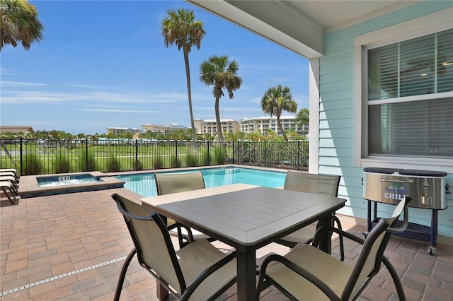 view of pool featuring an in ground hot tub and a patio