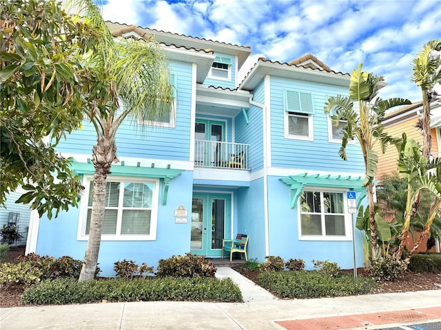 mediterranean / spanish-style house with french doors