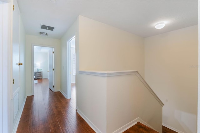 hallway with dark wood-type flooring