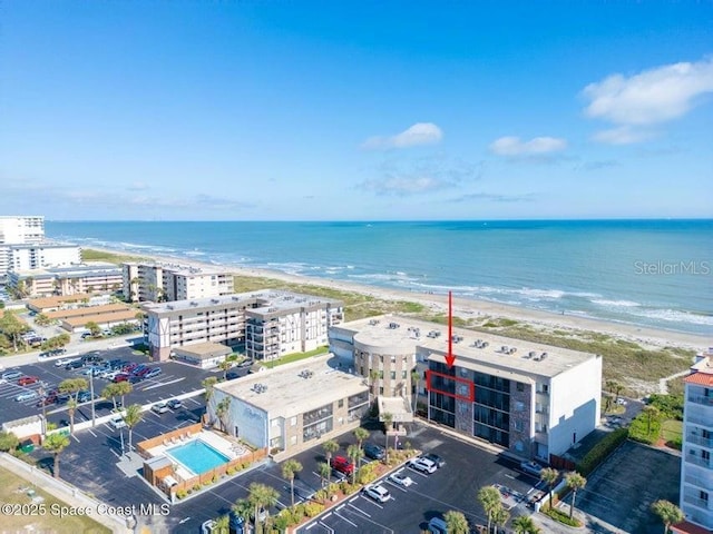 aerial view with a beach view and a water view