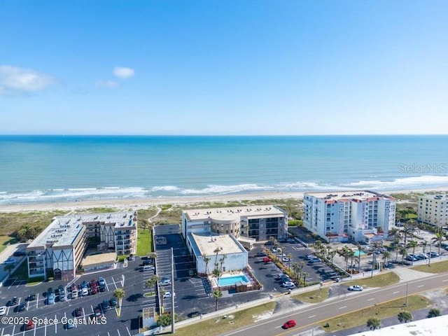 aerial view featuring a water view and a view of the beach