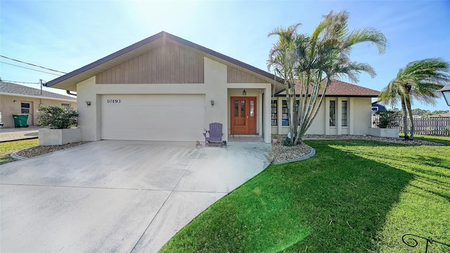 ranch-style house featuring a garage and a front lawn