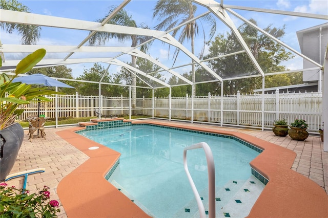 view of pool featuring a lanai and a patio