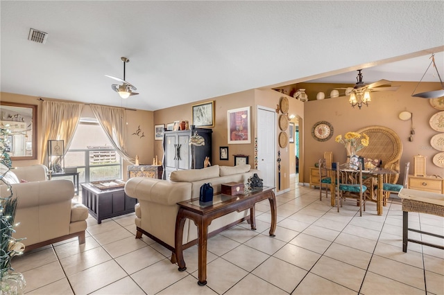 living room featuring light tile patterned floors and ceiling fan