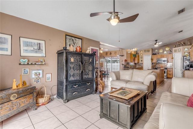 tiled living room featuring vaulted ceiling