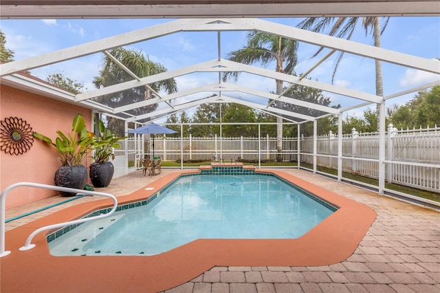 view of swimming pool with a lanai and a patio