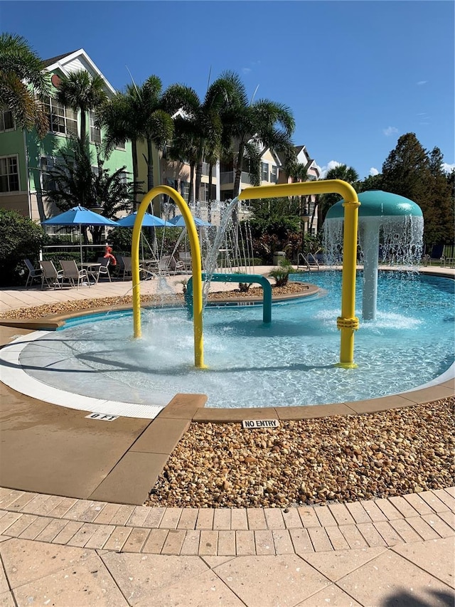 view of swimming pool featuring pool water feature