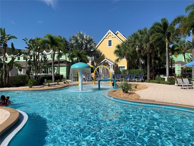 view of swimming pool featuring pool water feature