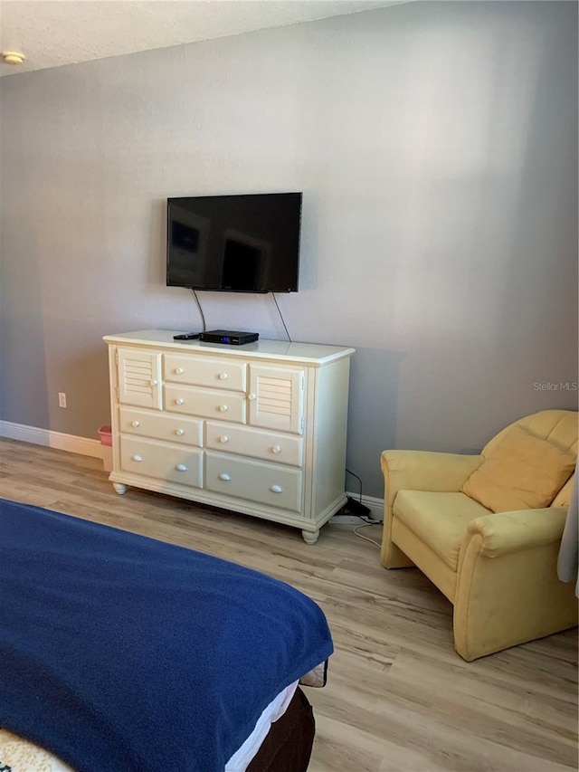 bedroom with light hardwood / wood-style floors