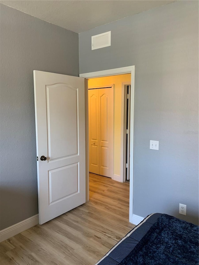 unfurnished bedroom with light hardwood / wood-style floors