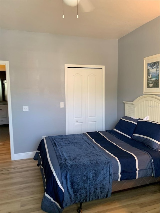 bedroom featuring hardwood / wood-style flooring and a closet