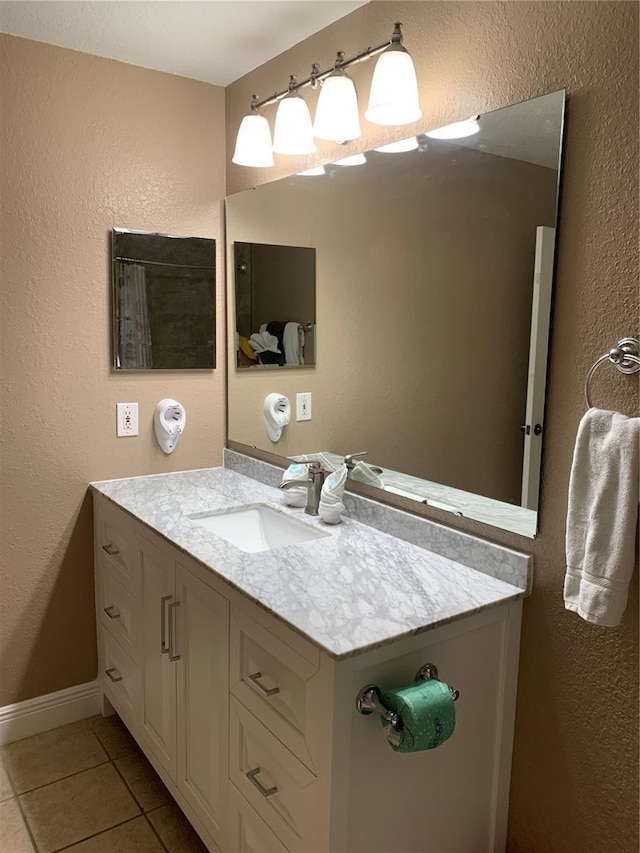 bathroom featuring tile patterned floors and vanity