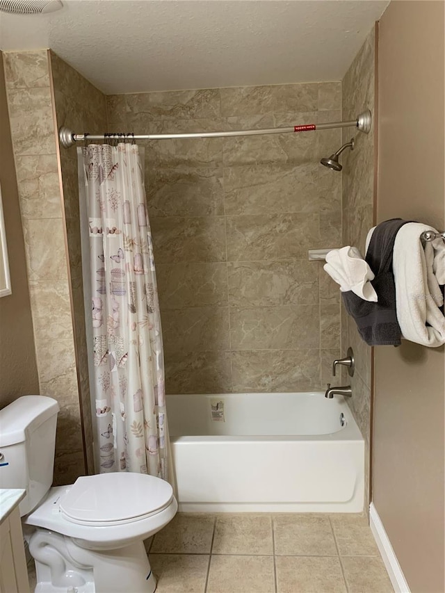 full bathroom with tile patterned flooring, a textured ceiling, toilet, shower / tub combo with curtain, and vanity