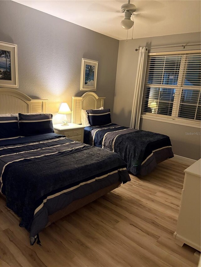 bedroom featuring ceiling fan and light wood-style floors