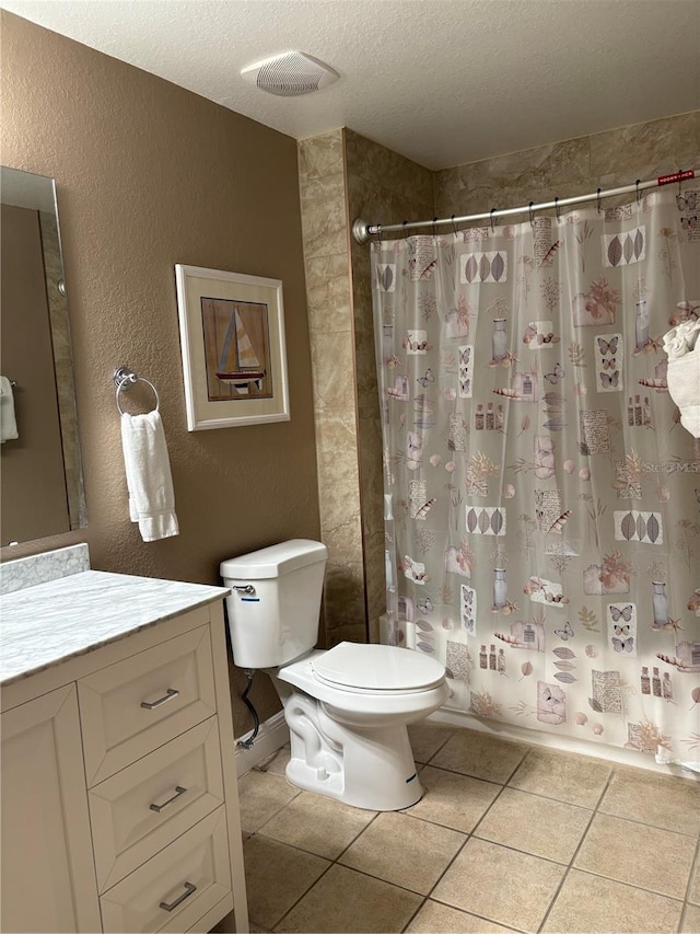 full bath with visible vents, tile patterned flooring, shower / bath combo with shower curtain, a textured ceiling, and vanity