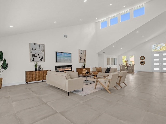 living room with a high ceiling