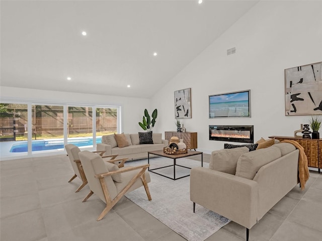 living room with high vaulted ceiling