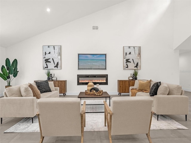 living room with high vaulted ceiling