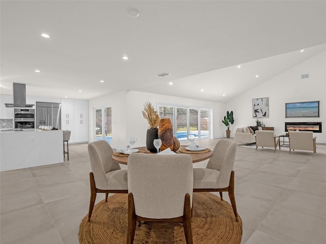 dining space with lofted ceiling