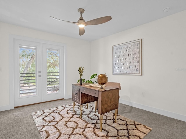 carpeted office with ceiling fan and french doors