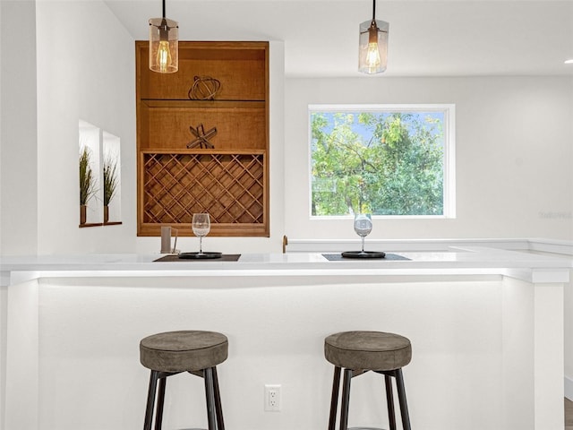 kitchen with pendant lighting and a breakfast bar