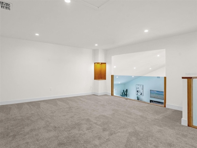 unfurnished living room featuring carpet floors