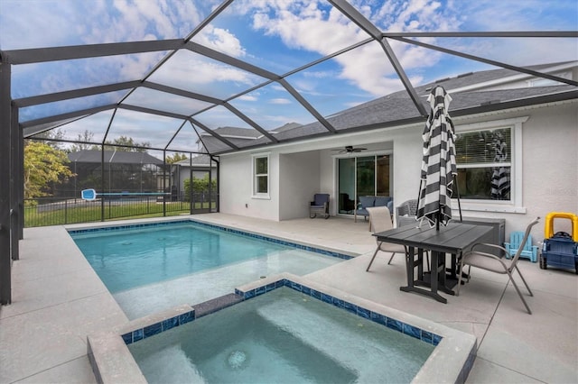 view of swimming pool featuring a fenced in pool, a patio, a ceiling fan, an in ground hot tub, and a lanai