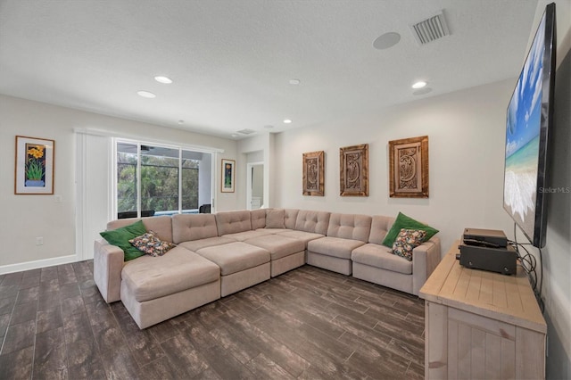 living area featuring recessed lighting, visible vents, dark wood-type flooring, a textured ceiling, and baseboards