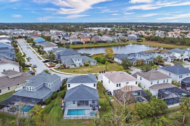 birds eye view of property featuring a residential view and a water view