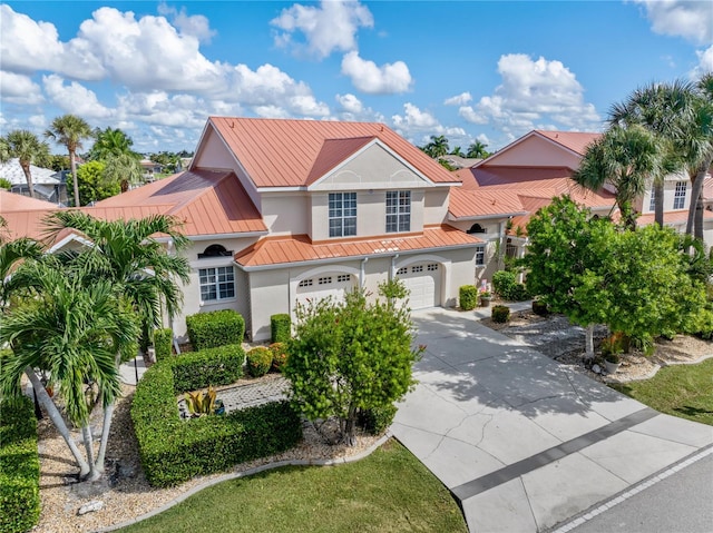 mediterranean / spanish-style house featuring a garage