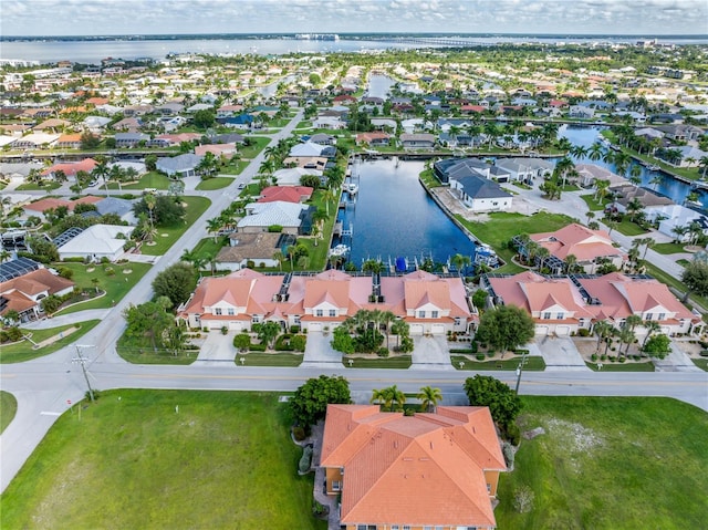 birds eye view of property with a water view