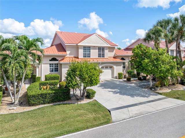 mediterranean / spanish-style home with a garage