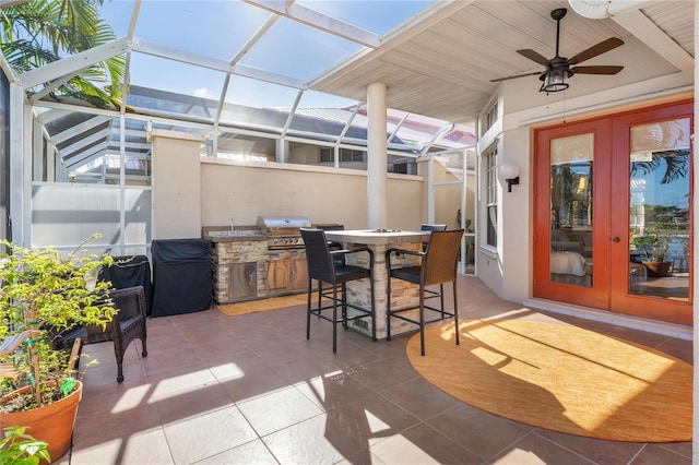 view of patio with french doors, grilling area, ceiling fan, and a lanai