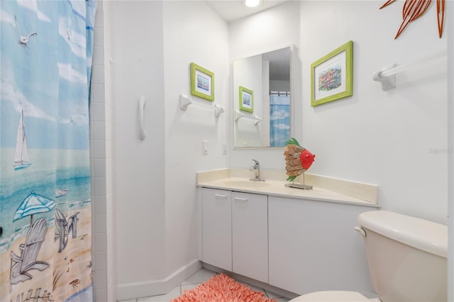 bathroom featuring tile patterned floors, vanity, toilet, and curtained shower