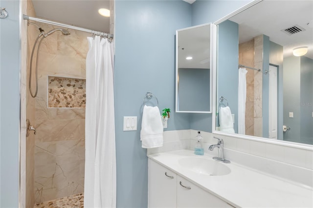 bathroom with vanity and curtained shower