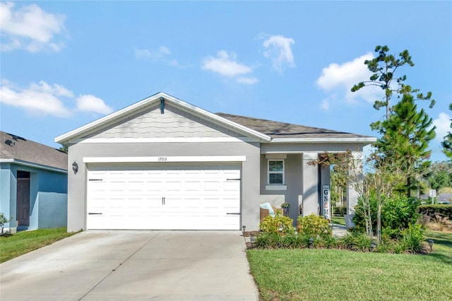 view of front facade featuring a garage and a front yard