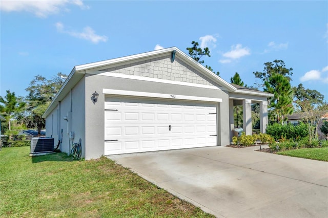 exterior space featuring a garage, central AC unit, and a front yard