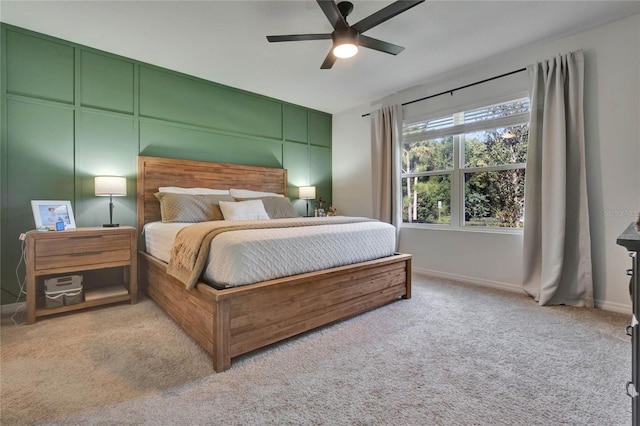 bedroom with light carpet and ceiling fan