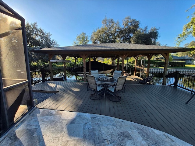 wooden deck featuring a water view