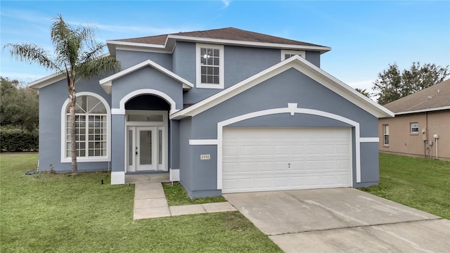 view of front of house featuring a front lawn and a garage