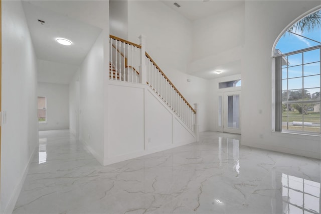 foyer entrance featuring a high ceiling