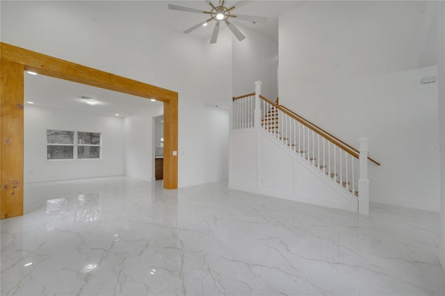 unfurnished living room featuring ceiling fan