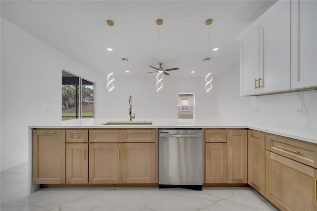 kitchen with ceiling fan, stainless steel dishwasher, kitchen peninsula, sink, and hanging light fixtures