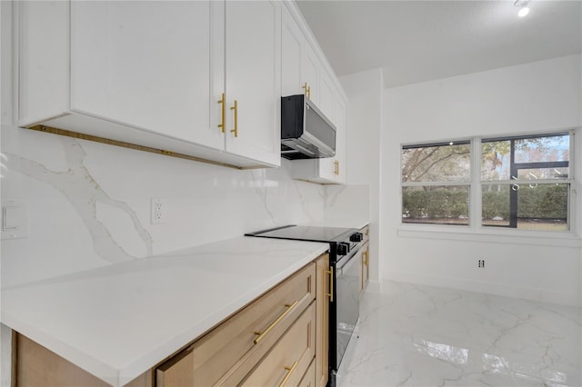 kitchen with white cabinets, range with electric cooktop, and light brown cabinets