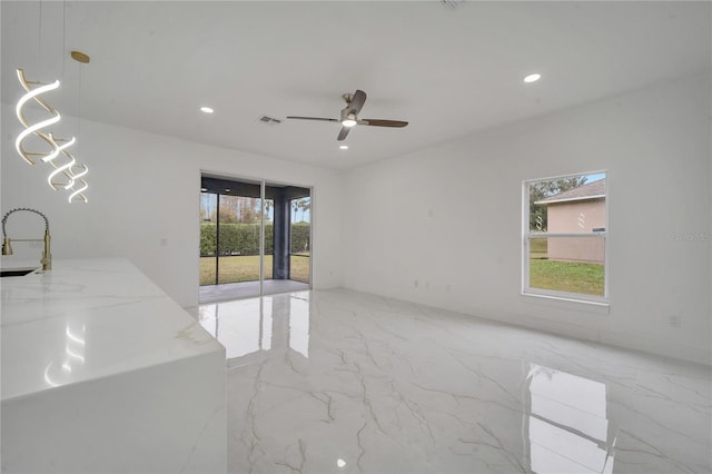 spare room with ceiling fan